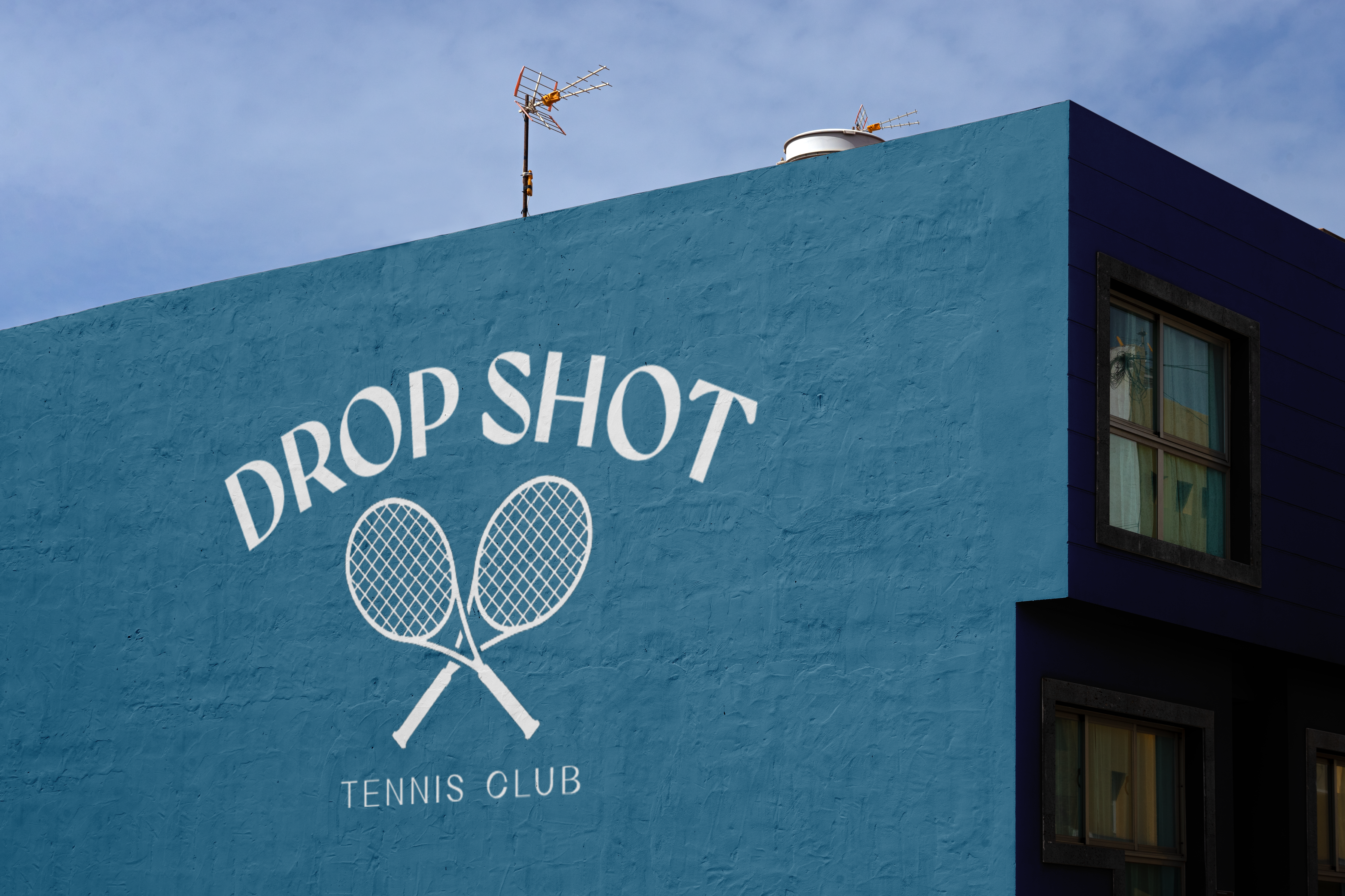 mockup of the Drop Shot logo on the side of a building